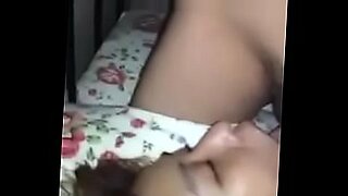 daughter jumps on daddy in bed