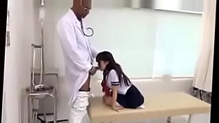 medical checkup of wife in front of husband