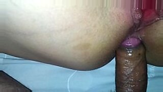brunette nympho sucking a cock dry at a gloryhole